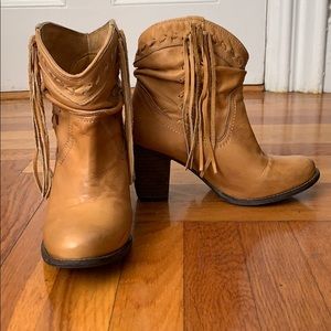 Tan ankle booties with fringe on the side